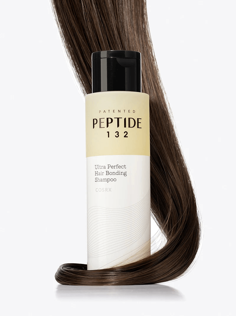 COSRX PEPTIDE-132 Ultra Perfect Hair Bonding Shampoo bottle with flowing brown hair.