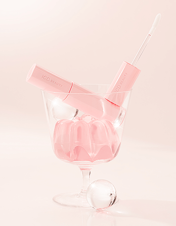 Riman ICD Beauty Glow Up Lip Oil in a glass with jelly; perfect for all-day lip care and overnight hydration.