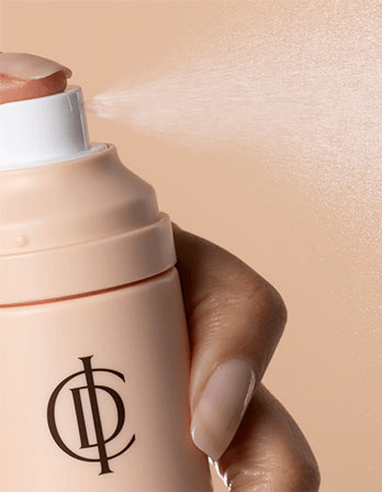 RIMAN ICD Makeup Set spray being applied, showcasing ultra-fine mist for setting makeup and skincare.