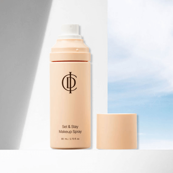 RIMAN ICD Set & Stay Makeup Spray bottle on a light background, showcasing its skincare-refreshing mist formula.