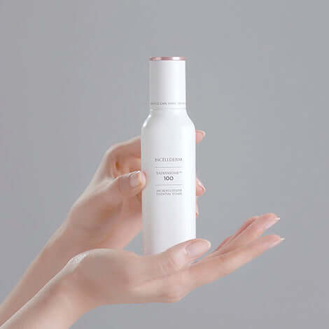 RADIANSOME 100 Microfluidizer Essential Toner in a hand, featuring advanced anti-aging benefits and moisturization.
