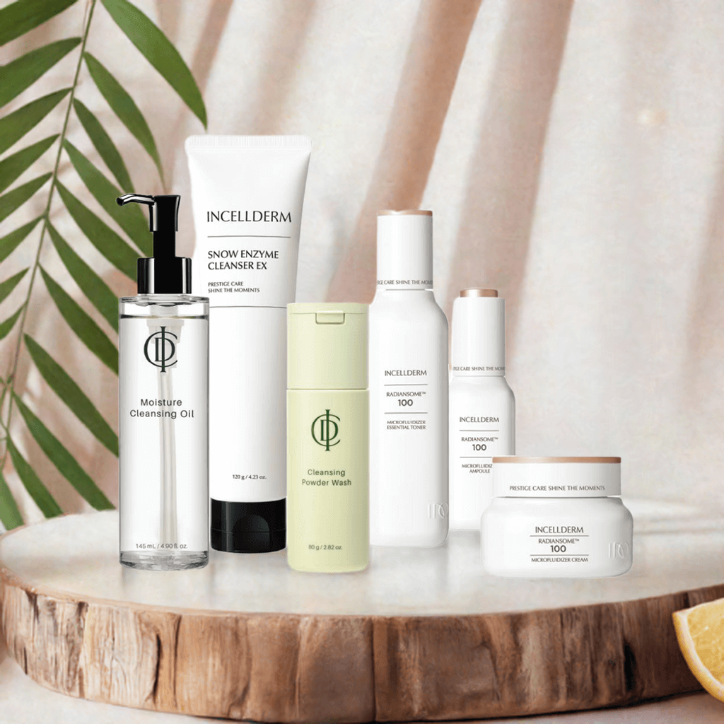 Set of Inceldderm skincare products including cleansing oil and enzyme cleanser on a tropical background.