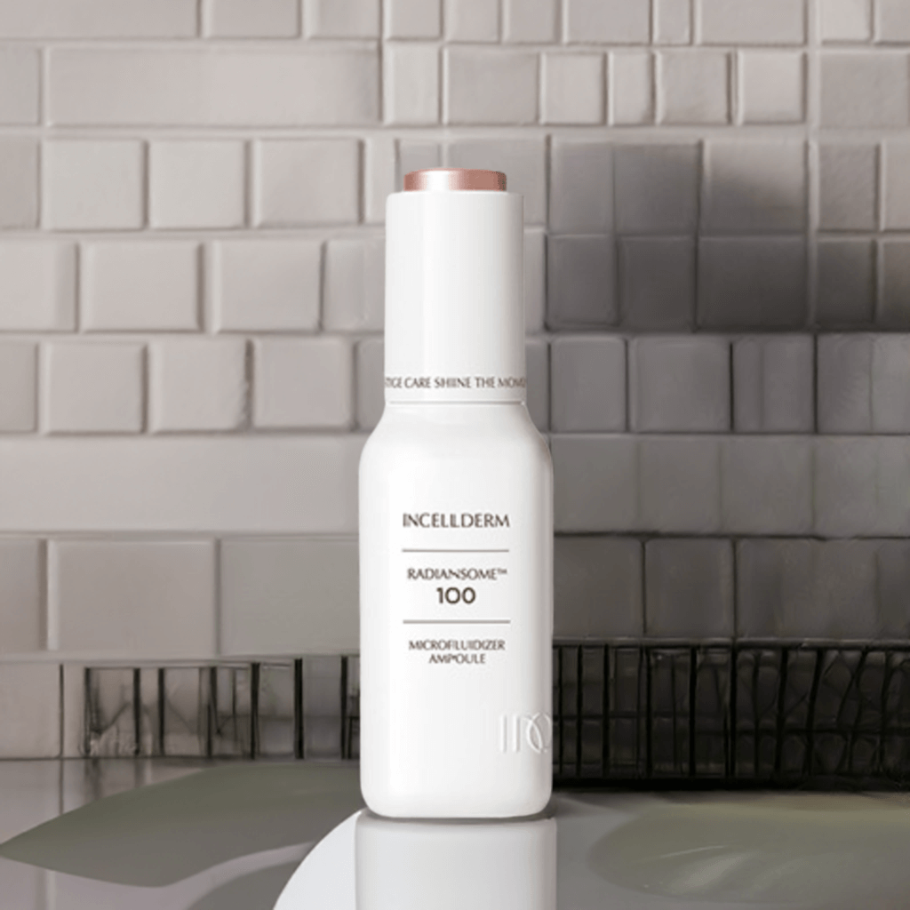RADIANSOME 100 Microfluidizer Ampoule in a sleek bottle, designed for fast-absorbing skin hydration and anti-aging benefits.