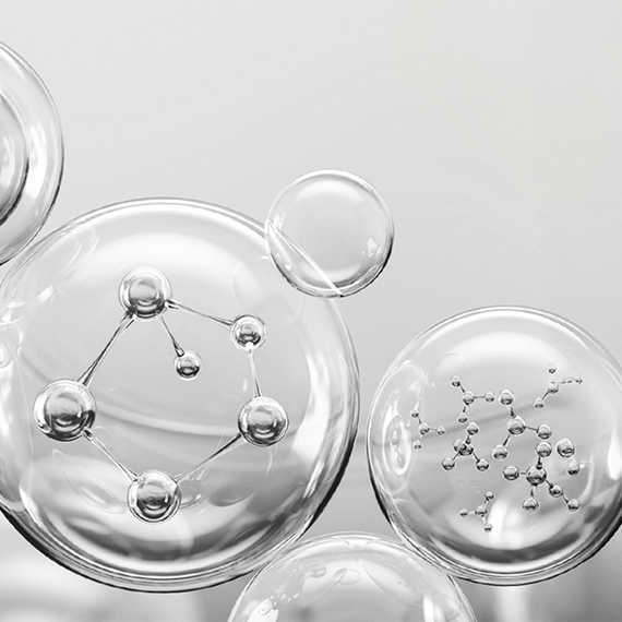 Close-up of molecular bubbles representing skincare ingredients for enhanced elasticity and hydration.