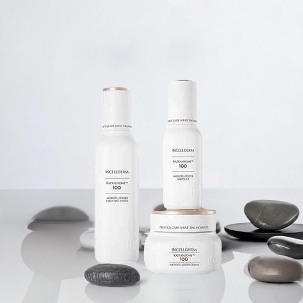 Riman Radiansome Premium Set featuring essential toner, ampoule, and cream on a minimalistic background with stones.