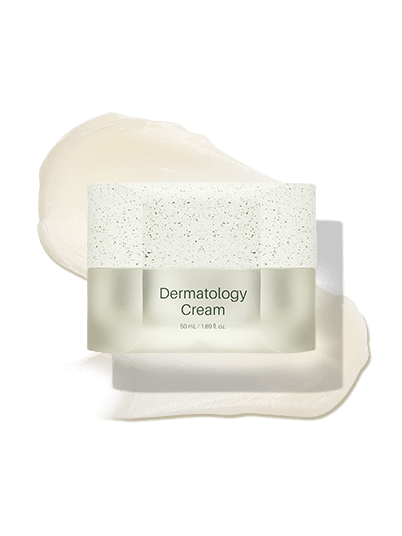 Riman ICD Dermatology Cream in a clear jar, showcasing its rich, creamy texture alongside a creamy swirl.