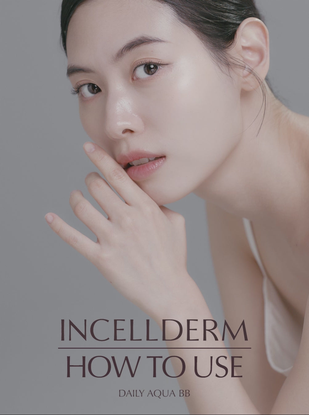 Model demonstrating application technique for Incellderm Daily Aqua BB makeup.