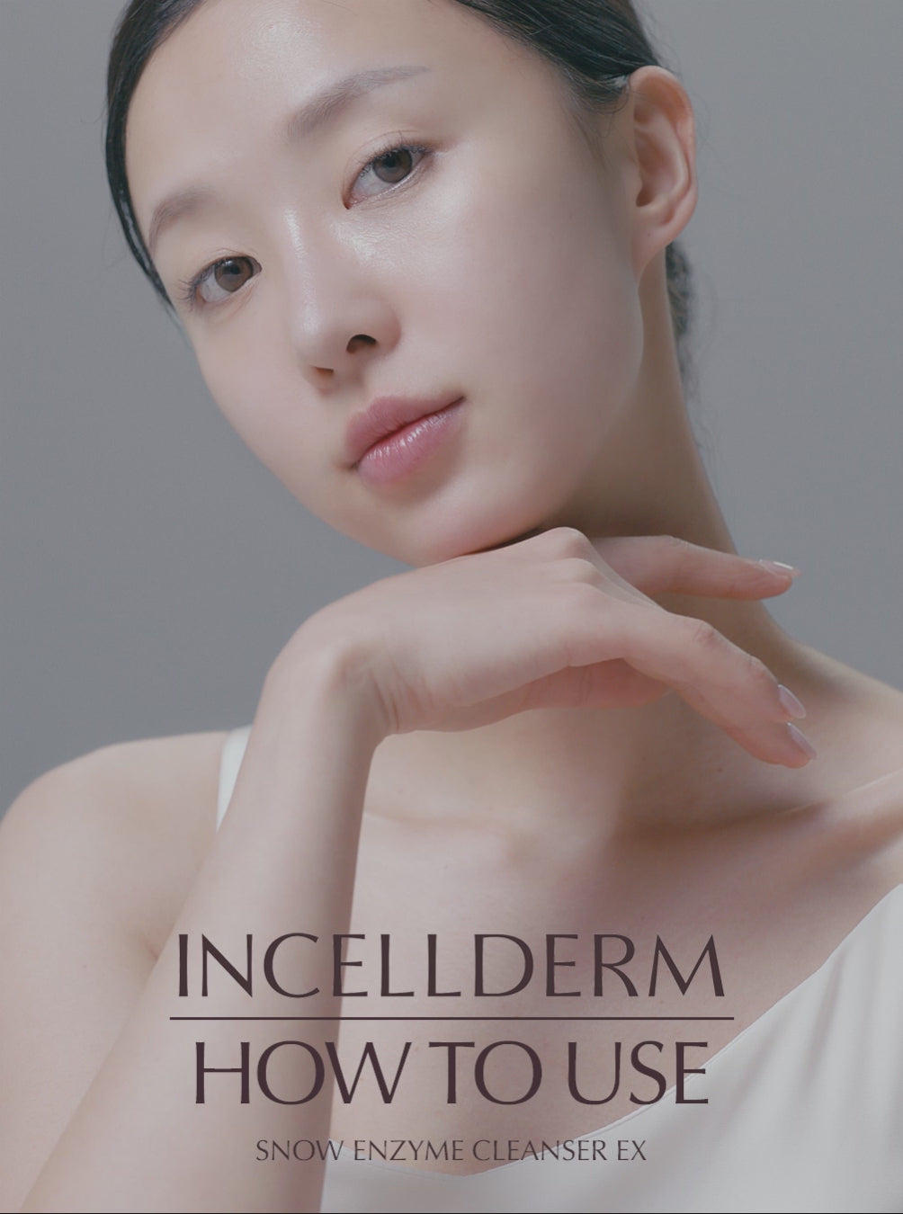 Model demonstrating how to use Riman Incellderm Snow Enzyme Cleanser EX for gentle skin cleansing.