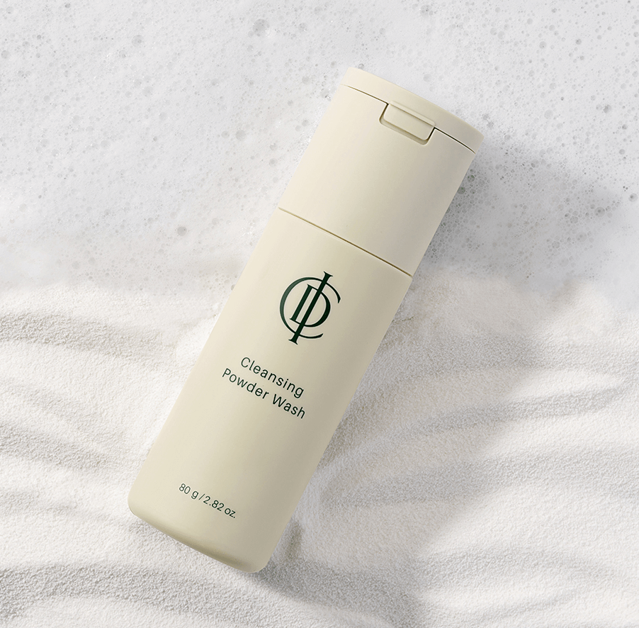 Riman ICD Cleansing Powder Wash bottle on a textured background, designed for gentle exfoliation and radiant skin.