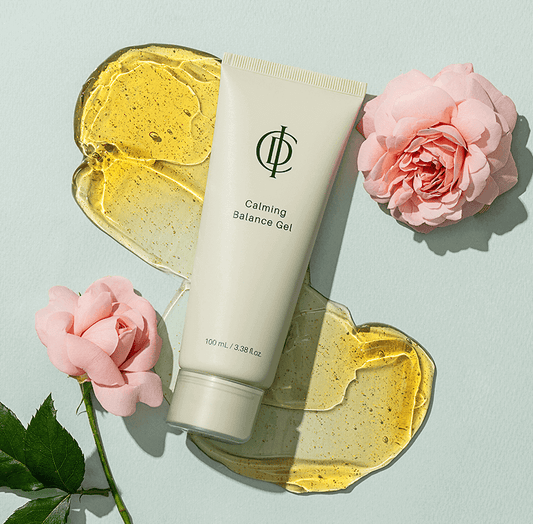 Riman ICD Calming Balance Gel tube with rose petals and gel on a soft green background.