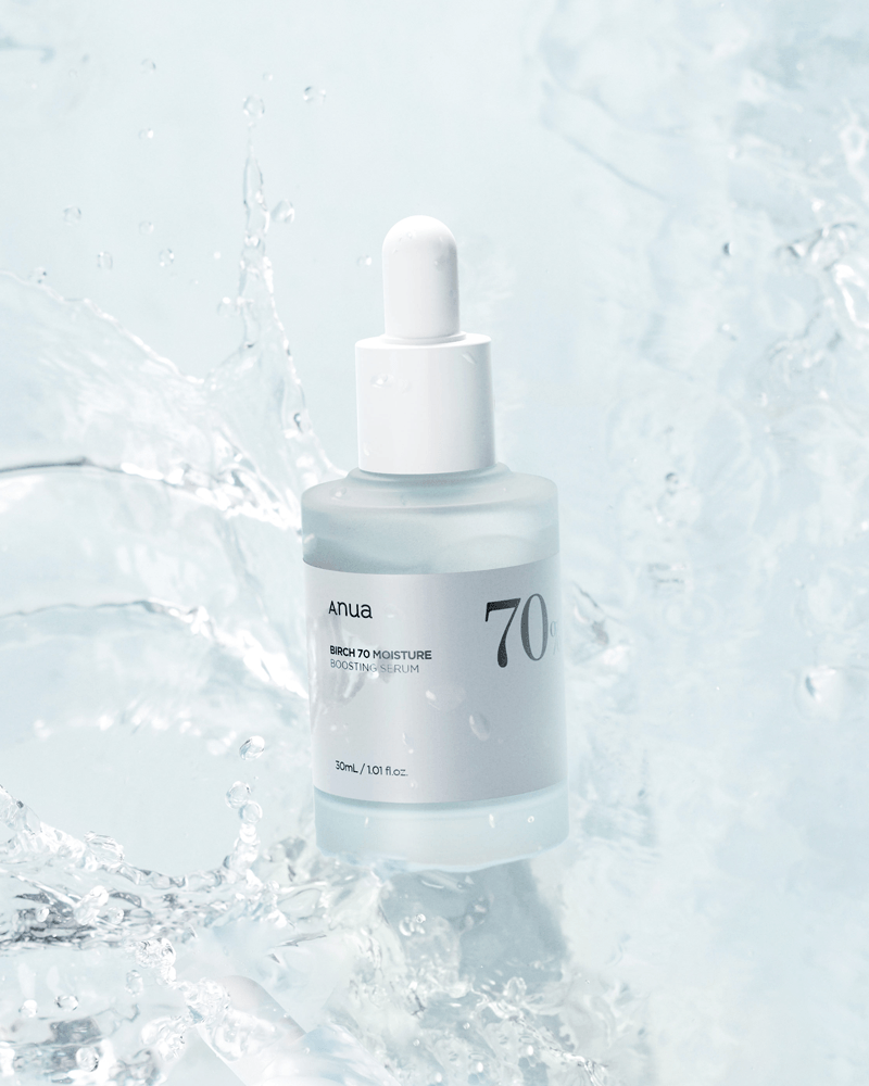 Anua Birch 70 Moisture Boosting Serum in splash of water, showcasing its hydrating and lightweight formula.
