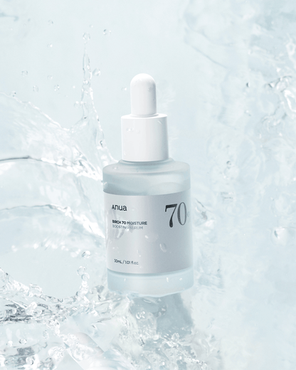 Anua Birch 70 Moisture Boosting Serum in splash of water, showcasing its hydrating and lightweight formula.