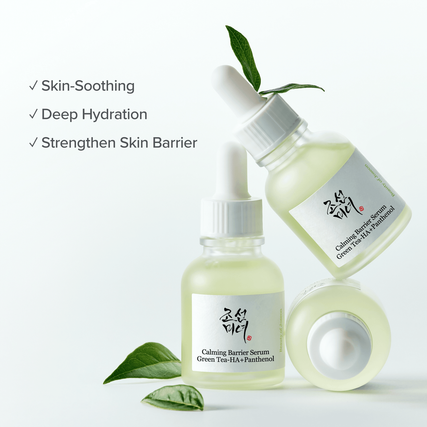 Beauty of Joseon Calming Serum Green Tea + Panthenol in elegant glass bottles with green tea leaves.