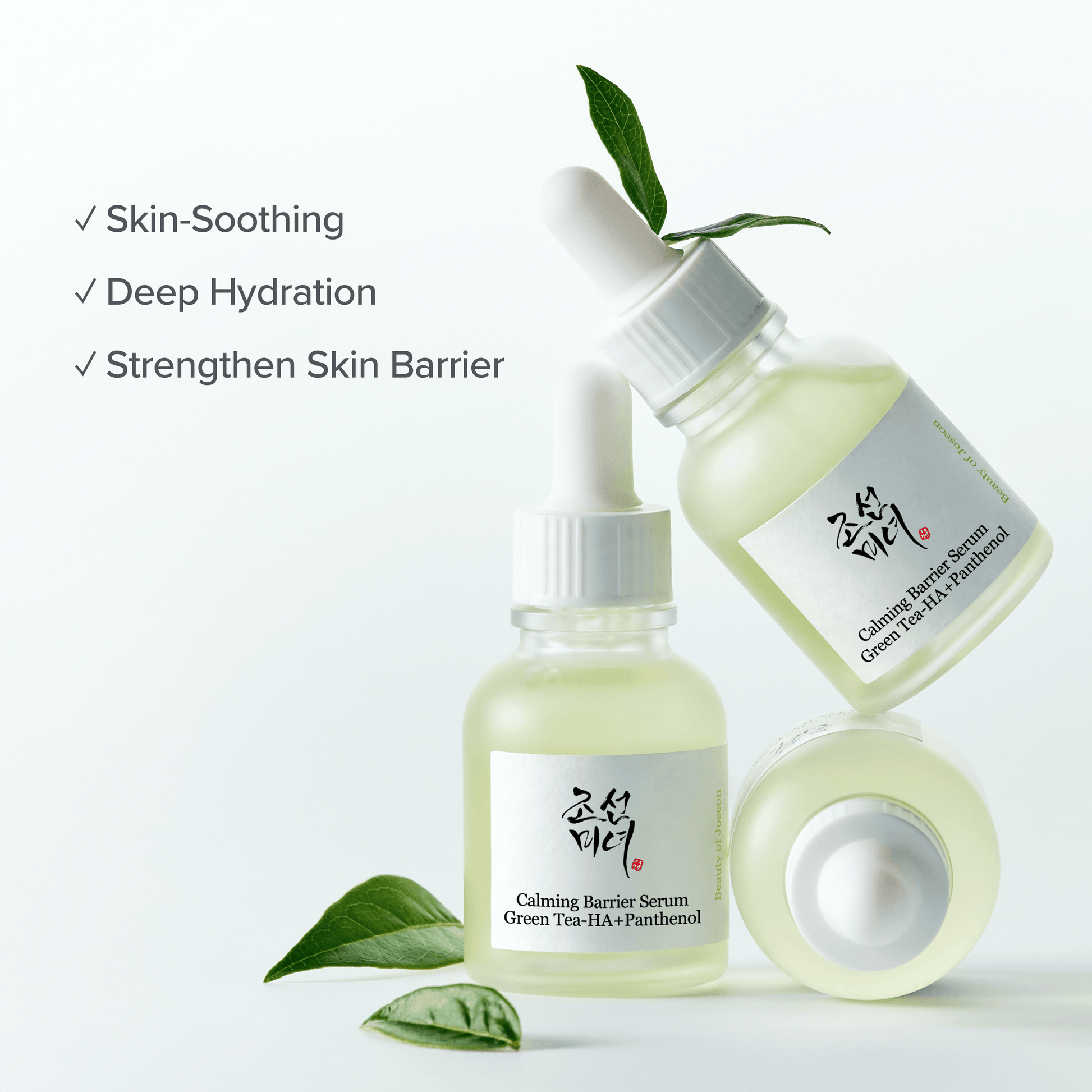 Beauty of Joseon Calming Serum Green Tea + Panthenol in elegant glass bottles with green tea leaves.