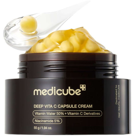 Medicube Deep Vita C Capsule Cream jar with yellow capsules and a unique dual-texture formula for brightening skin.