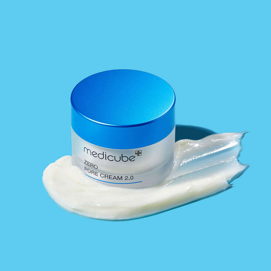 Medicube Zero Pore One-day Cream jar with cream on a blue background