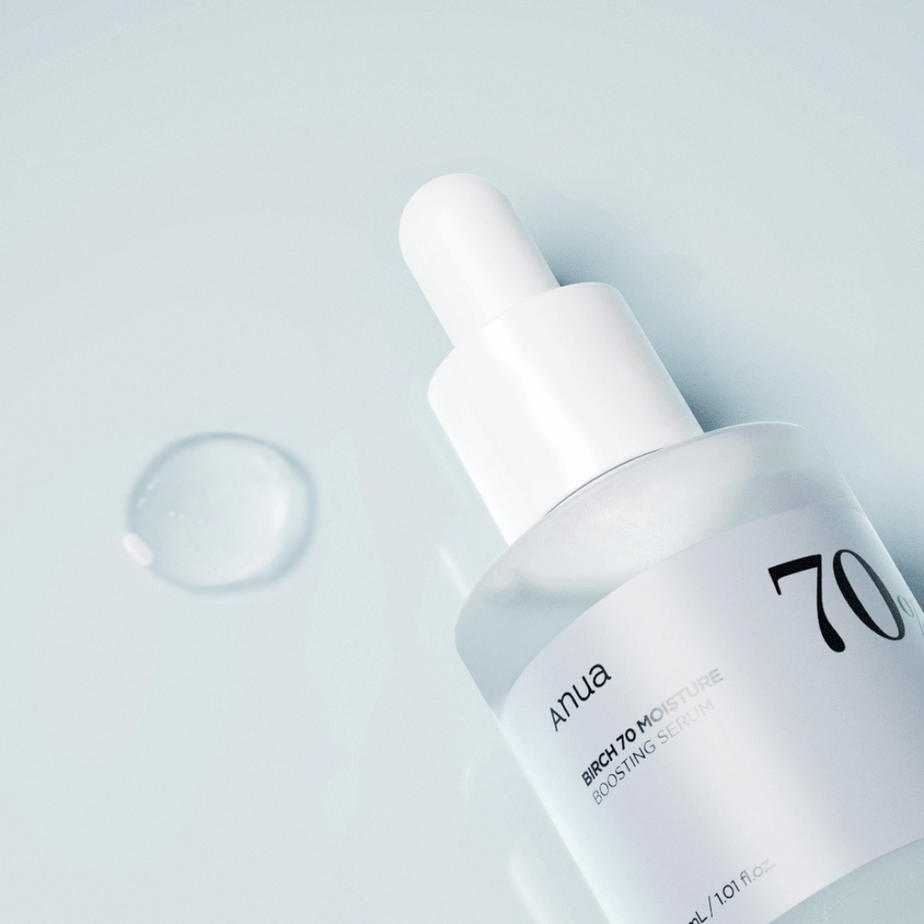 Anua Birch 70 Moisture Boosting Serum in a sleek glass bottle with dropper, showcasing moisture-boosting benefits.