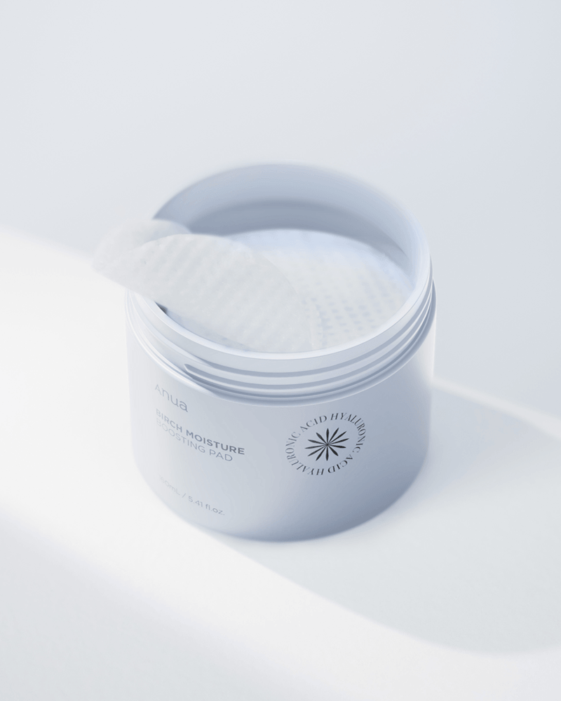 Anua Birch Moisture Boosting Pad in a jar with a toner pad visible on top.