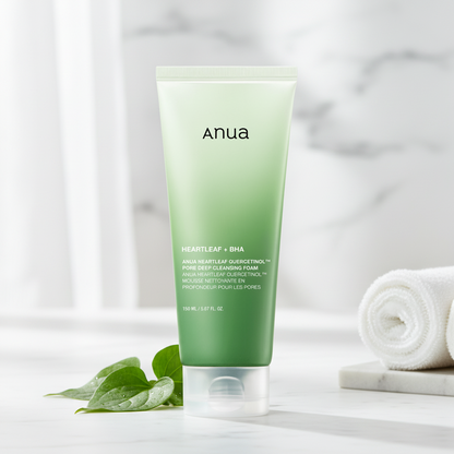 Anua Heartleaf Quercetinol Pore Deep Cleansing Foam tube with exfoliating cream background.