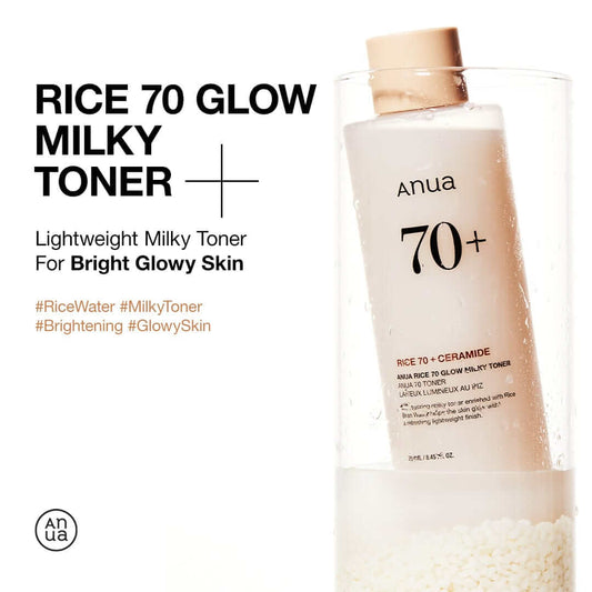 Anua Rice 70 Glow Milky Toner bottle placed in rice, promoting bright glowy skin with lightweight formula.