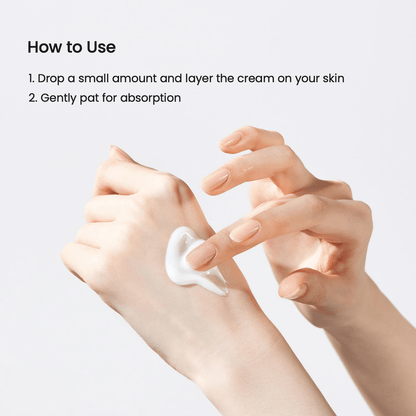 Person applying Biodance Skin Glow Essence Cream on their hand for hydration.