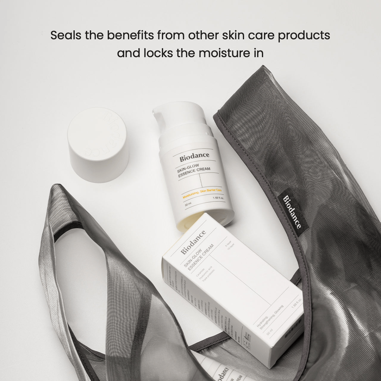 Biodance Skin Glow Essence Cream alongside other skincare products in a stylish bag, highlighting hydration and moisture retention.