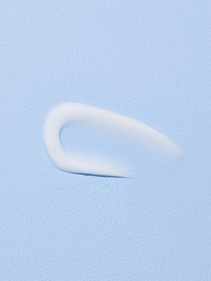 COSRX Hyaluronic Acid Intensive Cream swatch on a light blue background, showcasing its creamy texture.