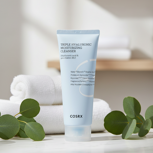 COSRX Triple Hyaluronic Moisturizing Cleanser in a light blue tube on a neutral background.