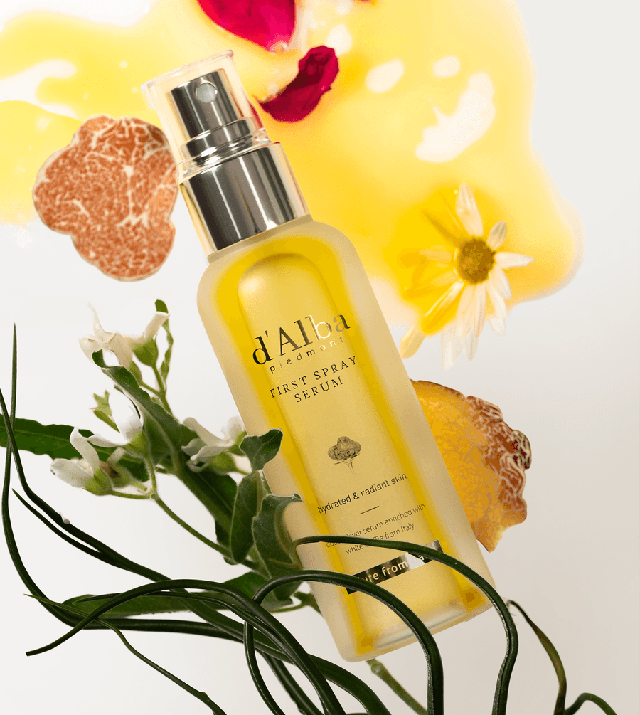d'Alba White Truffle First Spray Serum in a bottle with floral and truffle elements, showcasing hydration and radiance.