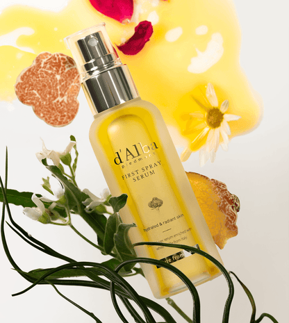 d'Alba White Truffle First Spray Serum in a bottle with floral and truffle elements, showcasing hydration and radiance.