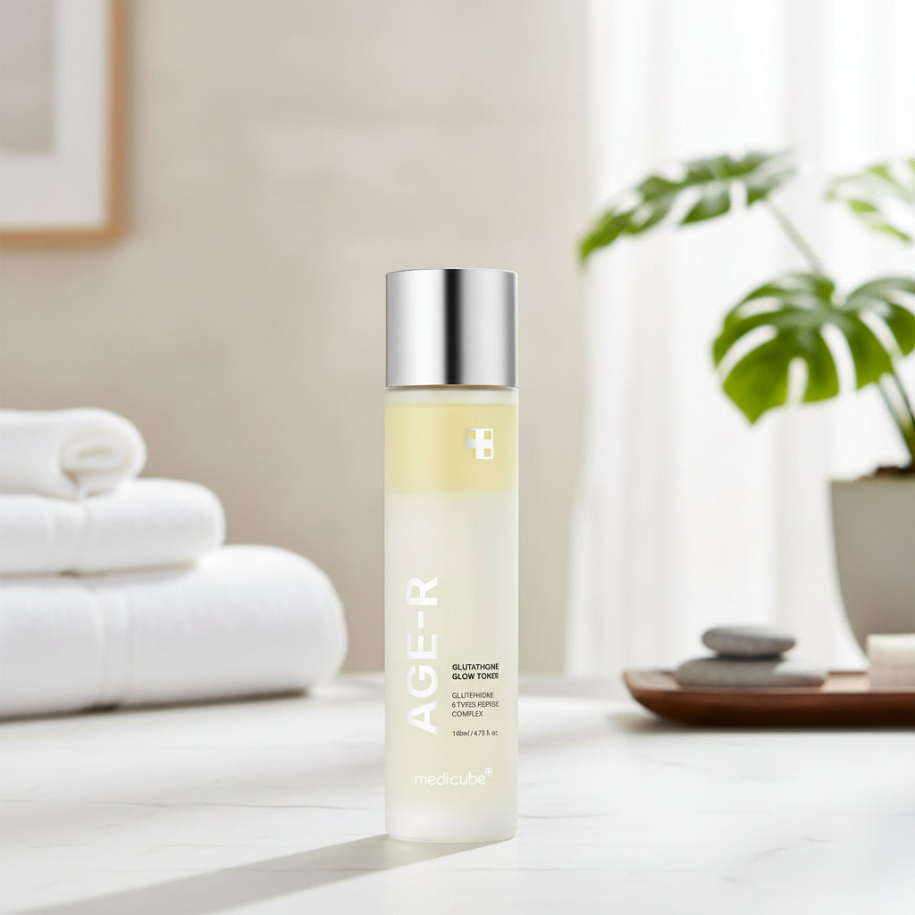 Medicube AGE-R Glutathione Glow Milk Toner bottle on a minimalist background with towels and plants.