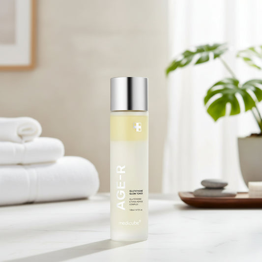 Medicube AGE-R Glutathione Glow Milk Toner bottle on a minimalist background with towels and plants.