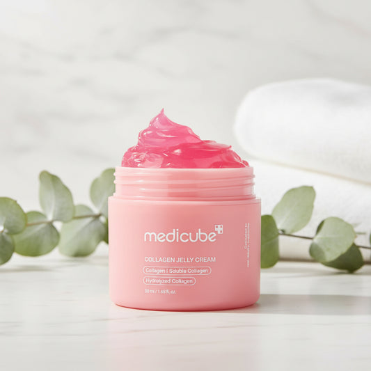 Medicube Collagen Niacinamide Jelly Cream in pink jar with cream texture, featuring a fresh, clean background.