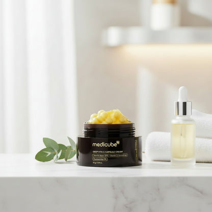 Medicube Deep Vita C Capsule Cream jar with yellow capsules and a unique dual-texture formula for brightening skin.