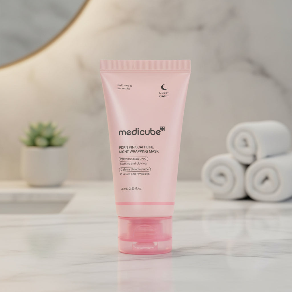 Medicube PDRN Pink Caffeine Overnight Wrapping Mask in pink packaging on a glittery round background.