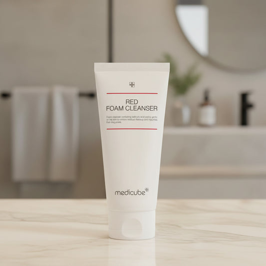 Medicube Red Foam Cleanser with foam on a white background