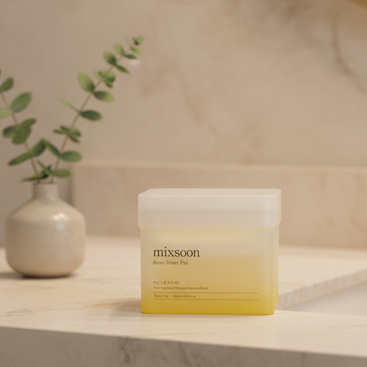 mixsoon Bean Toner Pad packaging in a clear container with a yellow gradient, promoting smooth and hydrated skin.