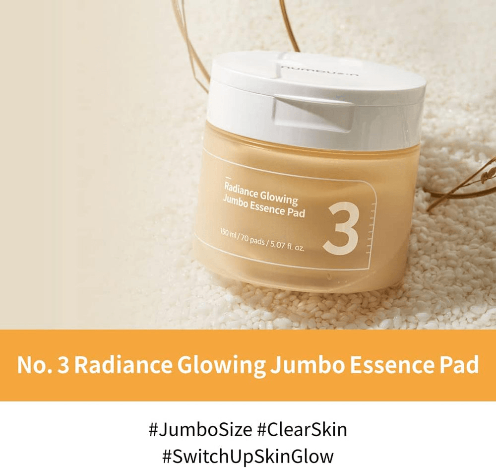 numbuzin No.3 Radiance Glowing Jumbo Essence Pads in a jar on a textured background, promoting skin hydration and glow.