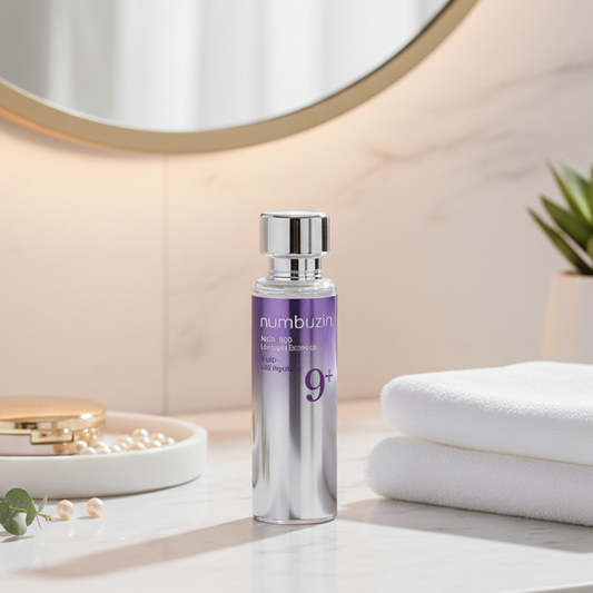 Numbuzin No. 9 NAD+ BIO Lifting-sil Essence bottle on a countertop with soft towels.