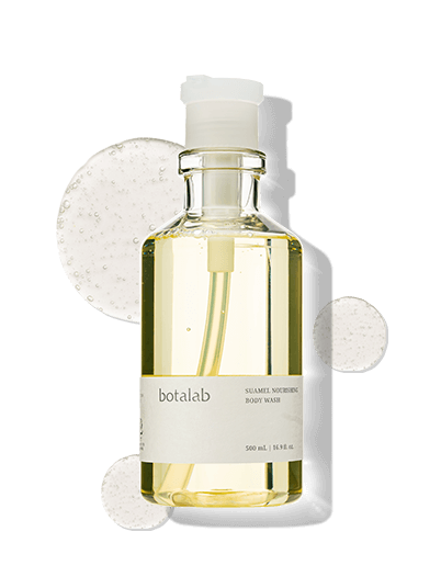 Suamel Nourishing Body Wash in a glass bottle, enriched with salicylic acid, hyaluronic acid, and collagen for hydrated skin.